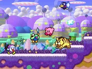 Kirby attacking some baddies afront the toxic swamp.