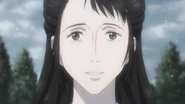 Reiko smiles at Shinichi while mimicking his mother's face.