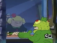 Iguanainjail.jpg (418 KB) The Iguana talking to an unidentified woman in the episode "Operation: C.H.O.C.O.L.A.T.E."