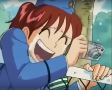 Naoko laughing at Ryotsu's attempts to get his fish back from a cat