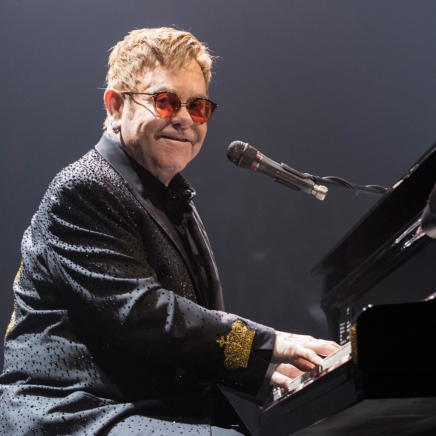 elton john playing piano