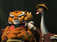 Mr. Ping trying to cheer Tigress up with a puppet