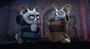 Shifu and his father posing after defeating Tong Fo