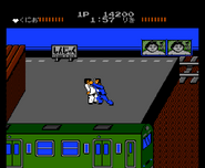 Kunio fighting Riki in the final area of Stage 1 on Level 1.