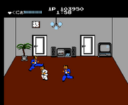 Kunio fighting clones of Riki in one of the rooms of the final stage.