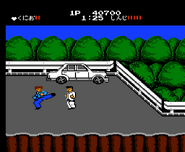 Kunio fighting Shinji in the final area of Stage 2 on Level 1.