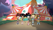 Five girls taking a circus tent for a walk.