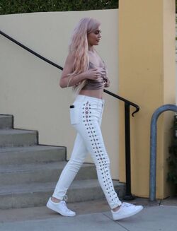 Kylie Jenner in grey sweatpants and white crop top on October 7