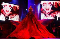 The dress housed 12 dancers underneath it, whilst Kylie was lifted 15ft above the stage