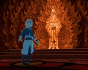 Aang davanti alla statua dell'Avatar Roku