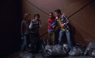 Adam, Bree and Chase trying to get Leo out of the recycling center