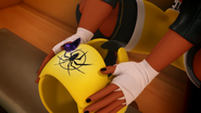 An akuma entering Nora's boxing helmet in "Anansi".