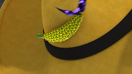 An akuma entering Chloé's banana-shaped pin in "Queen Banana".