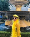 Platinum blonde bun with yellow baret