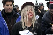Platinum-blonde half-long wet loose with black cap