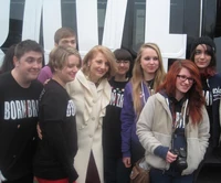 Cynthia with students outside Born Brave Bus on Feb