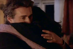 A worried Michael hugs Elena.