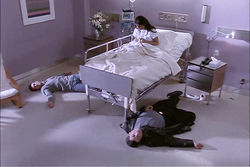 A catatonic Elena after Michael and her father are killed in front of her.