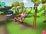Swinging with Kitty on the swing set