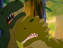 The sharptooth stops the charge of Papa Sharptooth with a headbutt