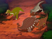 Raptors chasing a Kentrosaurus