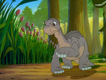 The Plated Sharptooth appears behind Littlefoot