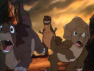 Sharptooth chases Littlefoot and Cera