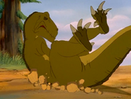 Mama Sharptooth crashes to the ground