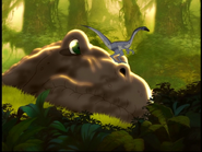 The tyrannosaur notices the little creature...