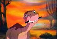 Littlefoot, chewing on a stick