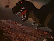 Sharptooth slides down towards Littlefoot and Cera.