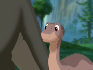 Littlefoot asks Cera if she wants to race him over to Ducky's and Spike's