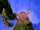 Littlefoot helps Mo jump over the big boulder