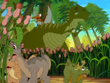 The sharptooth eats some of the flowers and sends the gang scrambling