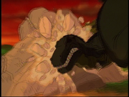 The Sharptooth collides with a pile of rocks