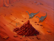 The dead sharpteeth's tails can be seen.