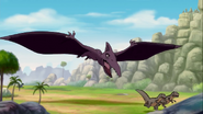 The Sharpteeth are pursued by the "great sharptooth flyer grabber"