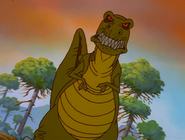 The sharptooth walks as the sky changes color to orange and red
