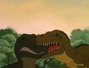 Mama Sharptooth accidentally biting Papa Sharptooth