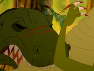 Chomper's father is slashed in the snout by the Plated Sharptooth.