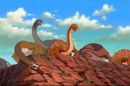 Grandma Longneck and others, watching the Sharptooth battle below.