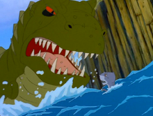 The sharptooth dives his mouth into the water in a last attempt to kill Chomper