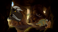 The kids attempt to avoid the Sharptooth by going inside a cave