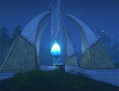 The portal spire at night. The giant blue crystal in the middle must be clicked to travel to other islands and severs. Stand right under the crystal and look up to click it