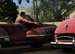 Roy, attempting to shoot the tires of a car out.