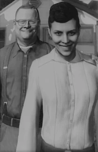 A photo of the happy Black couple found in Adrian's wallet.