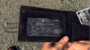 Phelps examines Adrian Black's wallet.