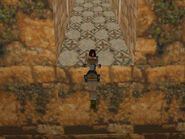 Pull up, wait a moment for Lara to slip off the edge and then press and hold the Jump button. Do not press Jump before she falls off the upper slope or she will jump from there and miss the opening to the secret.