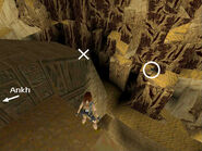 After placing the two Ankhs in the receptacles on top of the sphinx, climb back onto the sphinx's headdress on the right side (when facing the rear of the sphinx) and walk out to the corner marked with an X in the screenshot above.