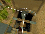 The screenshot above shows where you're trying to land: on the near right corner of the column. (The other arrow shows the normal path to the secret, from the greenery-covered ledge near the ANKH bridge switch.)